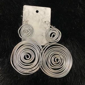 Handcrafted silver tone wire earrings.